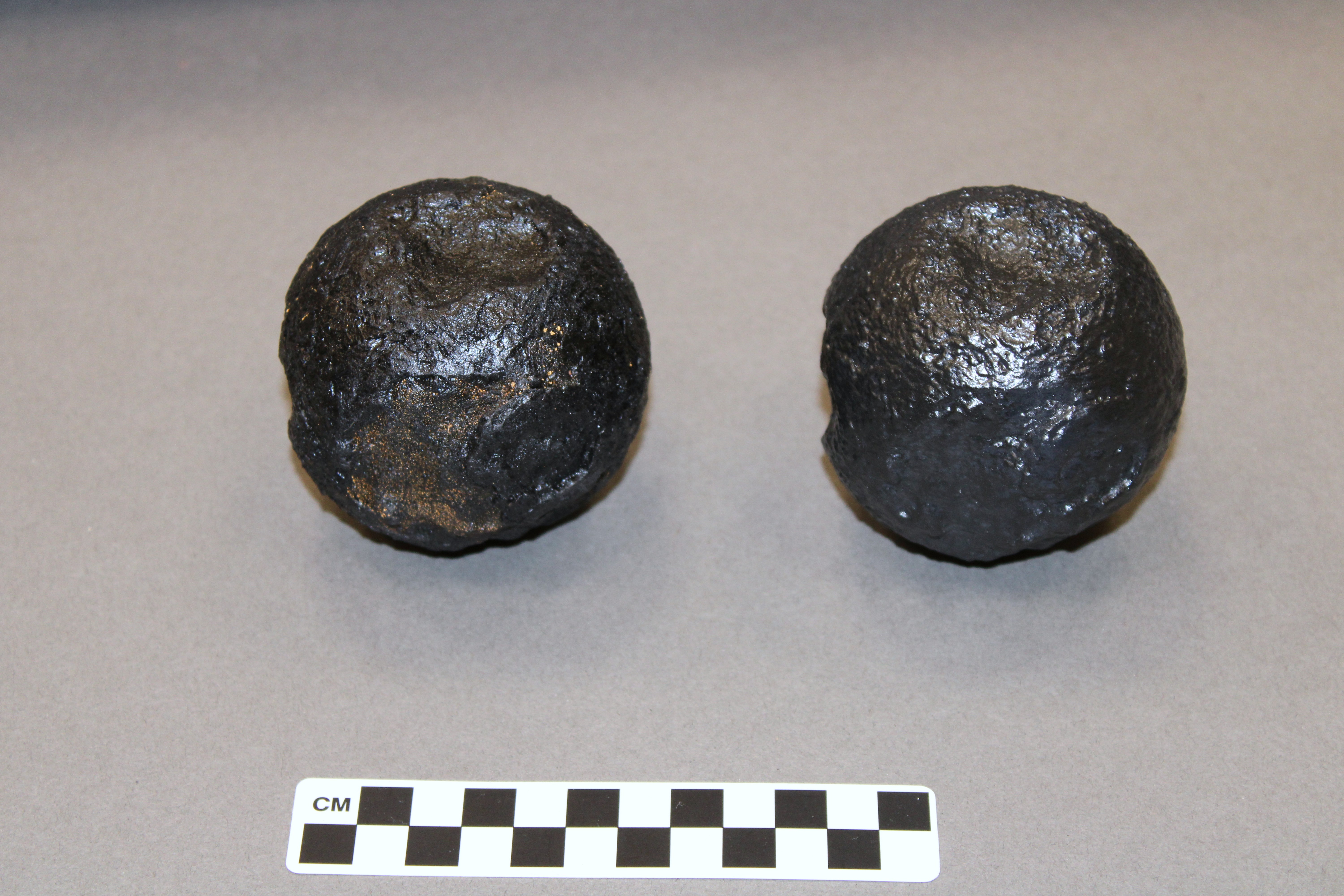 Left: Original cannonball, Right: Replica cannonball