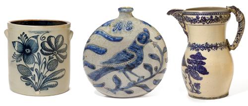 Three stoneware vases of different shapes, sizes, and decorations