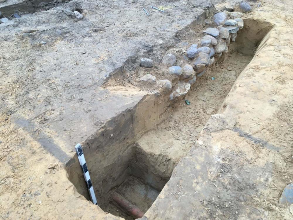 Excavation Site showing Stone Foundation and Drain Pipe