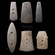 Ground stone gorgets, used for personal adornment, circa 3300-500 years before present.