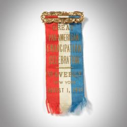 red, white, and blue ribbon with text in gold: Great Pan-American Emancipation Celebration