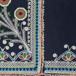 Floral and abstract beadwork on a dark background