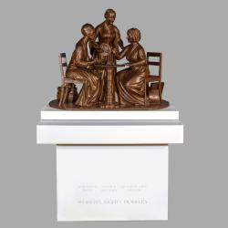Figurative sculpture depicting three women.