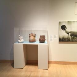 Shown left to right in exhibit case : Mother Fracker, Pottery Belly and Many into One - all works by Natasha Smoke Santiago