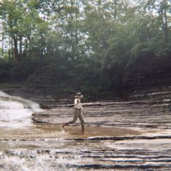 man walking on rocks