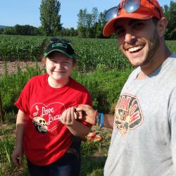 Volunteers Chelsea S. and John G. celebrate their fluted point find at OPS site, July 11, 2019.