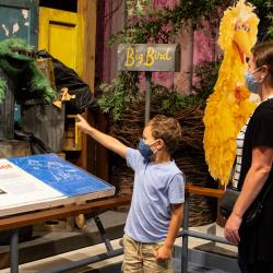 Visitors wearing masks in the NYSM