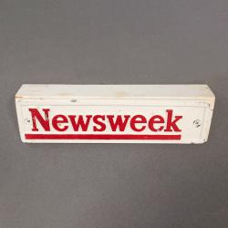 Newsweek, three-sided weight mounted on a wooded block