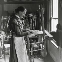 Sister Sarah Collins weaving a chair seat
