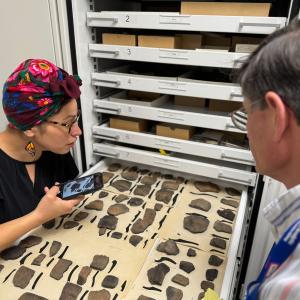Natasha Smoke-Santiago examines pottery rim sherds 