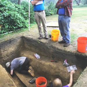 Dr. Michael Lucas, Curator of Historical Archaeology (left) and Marty Pickands, retired museum archaeologist (right) overlooking excavation by SUNY Albany field school students -- photo by Derek J. Healey