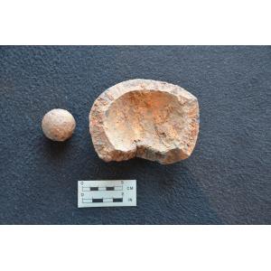 A piece of grape shot (left) and an exploded mortar bomb (right) recovered during scientific excavation at the Lake George Battlefield Park