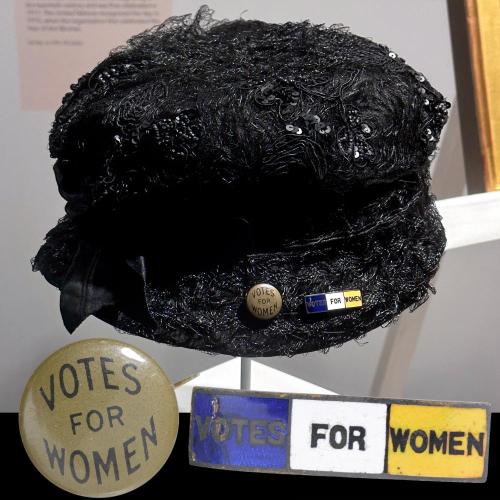 vintage black hat with Votes for Women pins