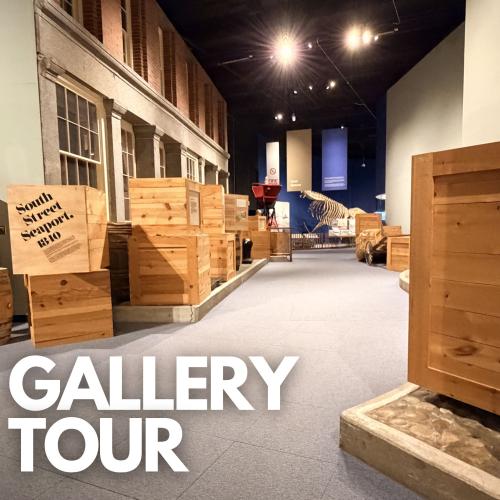 Gallery Tour text over photo of the South Street Seaport gallery that includes a number of wooden shipping boxes