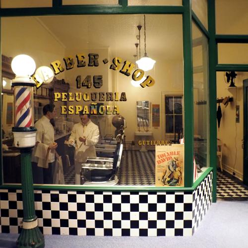 Storefront of the Gutierrez Barbershop on exhibit at the NYSM