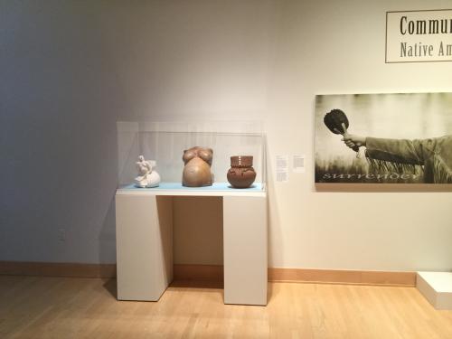 Shown left to right in exhibit case : Mother Fracker, Pottery Belly and Many into One - all works by Natasha Smoke Santiago