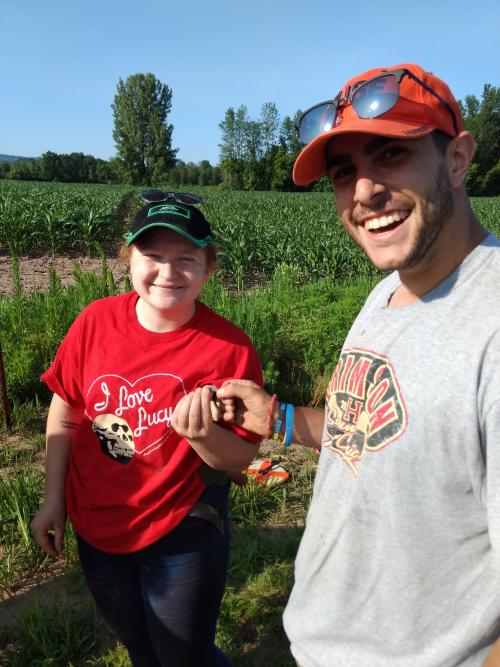 Volunteers Chelsea S. and John G. celebrate their fluted point find at OPS site, July 11, 2019.